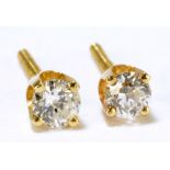 A pair of 14ct yellow gold diamond ear studs, combined diamonds weighing 0.