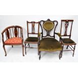 Five various Edwardian chairs to include a hoop back example with floral padded seat and a carved