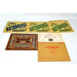 An 'Autobridge' playing board and deal sheets.