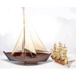 A model of a yacht, length 46cm, and a further smaller model of a masted ship (2).