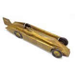 A Golden Arrow 1929 tin clockwork toy car, length 52cm, with key.