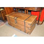 A 20th century hardwood strap bound trunk, width 102cm.