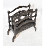 A late 19th century dark oak two division magazine rack, width 46cm.