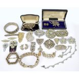 A group of costume jewellery, each piece set with cubic zirconia to include Art Deco brooches,