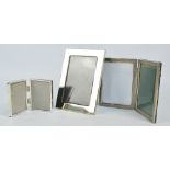 An Italian silver folding double rectangular photograph frame with engine turned decoration,