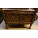 An Afghan dowry chest, the front with profusely carved geometric decoration and sliding right panel,