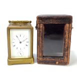 A circa 1900 French brass repeater and alarm carriage clock with circular chapter ring set with