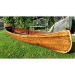 A rare late 19th century Canadian Canoe Company of Peterboro Ontario cedar and copper stud canoe,