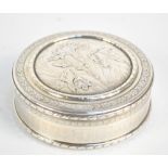 A late 19th century French silver Art Nouveau style circular box cast and engraved with floral