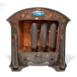 An early 20th century Arts and Crafts electric radiator with domed front bearing an oval Ruskin