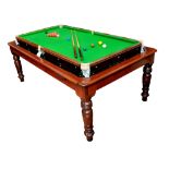 A combination pine and stained beech dining table/billiards table with plank top above slate bedded