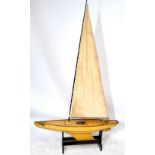 An early 20th century wooden pond yacht with rigging,