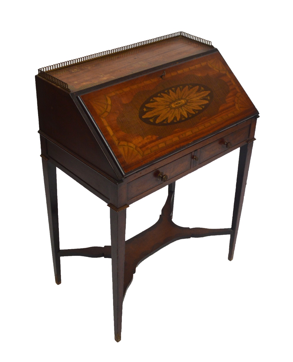 An Edwardian satinwood and inlaid lady's bureau with pierced brass galleried top and floral