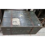 Black watch trunk with shipping labels London to Bombay