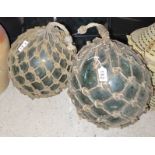 2 glass fishing floats with rope