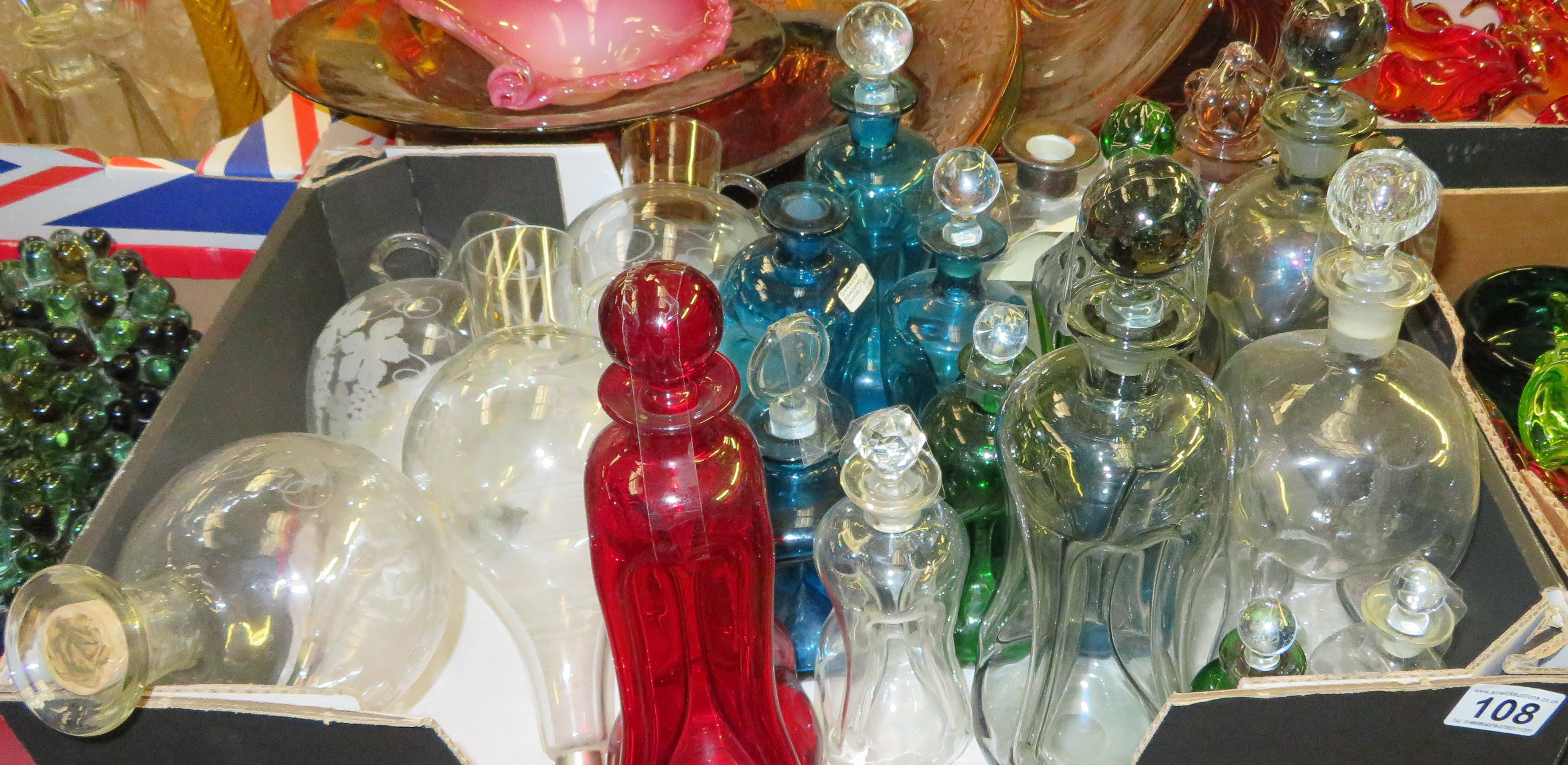 Large collection of waisted decanters