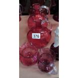 6 cranberry jugs