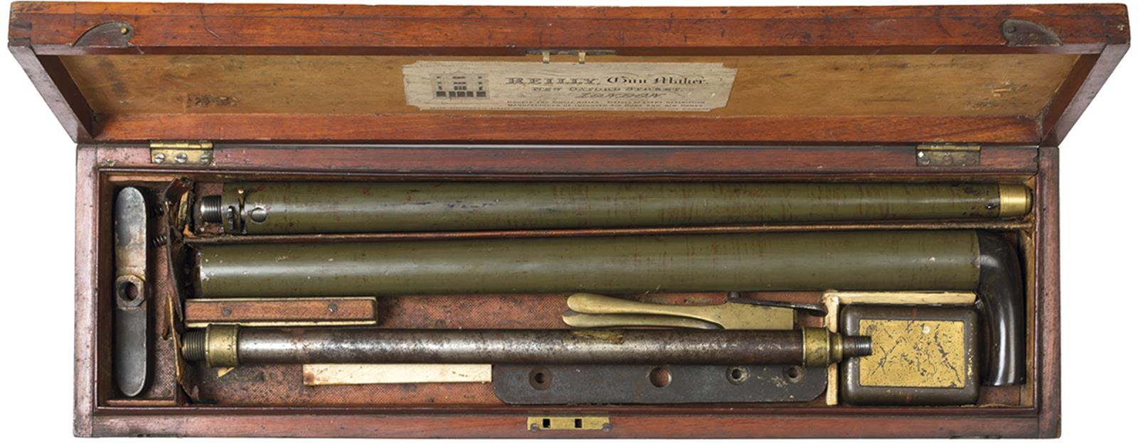 A cased 88-bore walking stick air cane by Reilly, the green painted body with horn handle, rifled