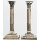 A pair of silver Corinthian column candlesticks, Sheffield 1892 by Goldsmiths and Silversmiths