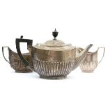 A silver three piece tea service by William Hutton & Sons Ltd, London 1907, of plain form with