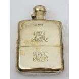 A silver hip flask by James Dixon & Sons, Sheffield 1917, monogrammed, 14cm high, together with a