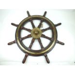 An early 20th Century eight pointed teak and brass mounted ship's wheel by Scottish marine engineers