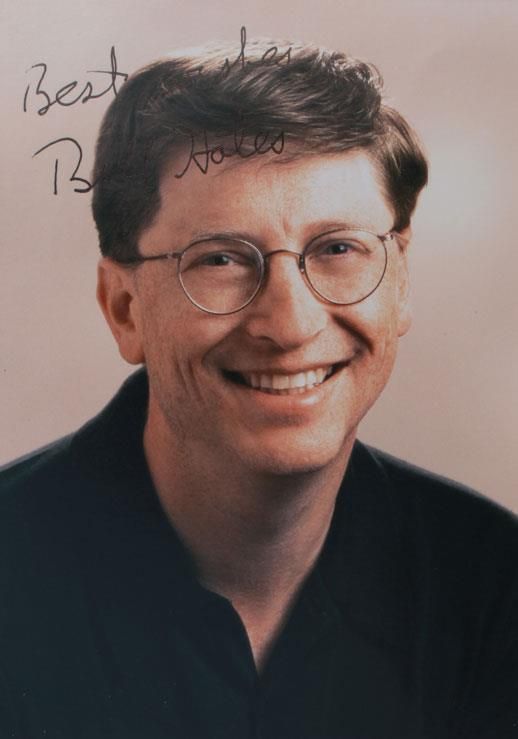Gates, Bill, US-amerikanischer Unternehmer (1955). Eh. Gruß u. Unterschrift auf e. farb.