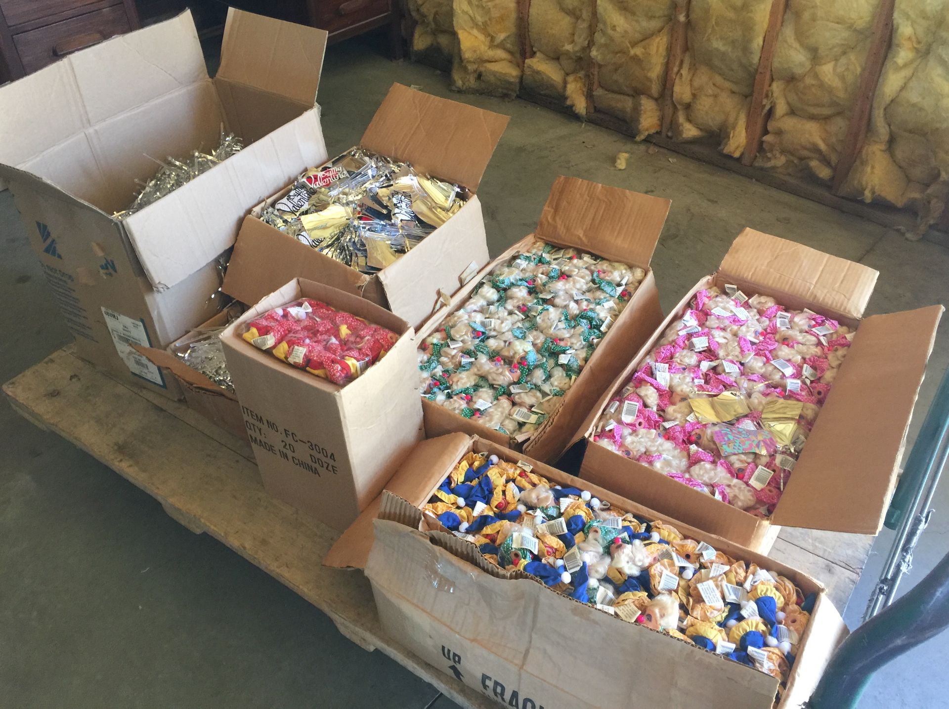 THOUSANDS OF BRAND NEW CASE PACKED DOLL HEADS AND SMALL CELEBRATION FLAGS