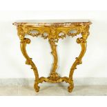 A Piemontese baroque console, on two shaped legs with lower connetion in shape of volutes and a