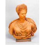 Terraccotta bust of an elegant lady in Renaissance style toga with curled hair on wooden base;