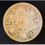 An early Persian pottery bowl pottery, possibly Nishapur; with green points and brown decorations;