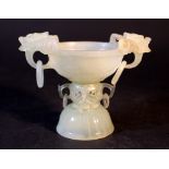 A very fine Chinese jade bowl on a round dome foot grooved; the middle section with open work