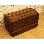 Small travel casket with bowed lid and wooden sections; iron fittings and partly with textile