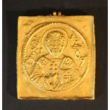 A gold amulet with two eyes and chased St. Nicholas with inscription; possibly part of a reliquary