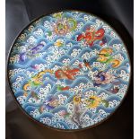 Large Asian cloisone plate with multicoloured enamel decorated with dragons, flowers and objects;