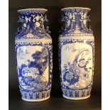 A pair of large Chinese hall vases with side grips, wide neck, blue painted on white ground.95cm