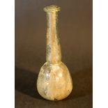 Small glass flask with round body and long neck, the upper hole border extended; transparent