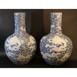 A pair of large Chinese hall vases in bowl shape with long small necks; partly with dragons in