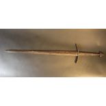 A Medieval iron sword with hand grip part and hand protection; possibly earth found, rusty; possibly