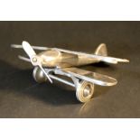 A miniature model of biplane, metal chromed; 20th Century.20 cm