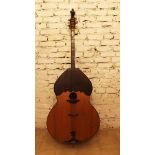 A large double bass instrument, with light and dark wood elements, long neck with scroll ending,