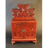 Asian lacquer miniature cabinet with very fine lacquer painted leaves, branches and litchi flowers
