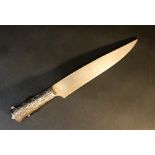 Oriental knife with wide blade and richly decorated steel cutted hand grip with Arabic letters;