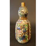 A Persian ceramic flask with painted family scenes, animals and flowers, on white ground, glazed,