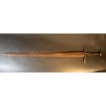 A large Medieval iron sword with hand grip part and hand protection; possibly earth found, rusty;