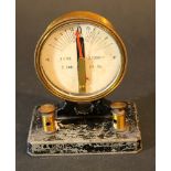 Tachometer with round paper scale, in gilded bronze mantle with glass; on iron base with two cable