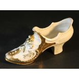 Ladie's porcelain shoe with relief decorations, partly gilded and white glazed; possibly Bohemia