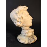 A marble head of a youth with cap and waved hair, in ancient manner; white marble (base not
