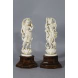 A pair of Indian ivory sculptures with female goddesses on lotus flowers, with several arms, animals