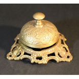 A bronze table bell, richly decorated, 20th Century.10 cm